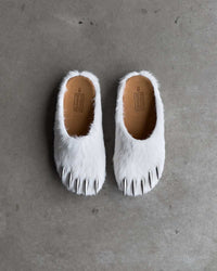 Bravest Studios Bear Claw Mule white furry slip-on with claw detailing, overtop view