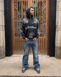 Bravest Studios Flare Denim Pants blue, full-length model shot styled with a black zip hoodie