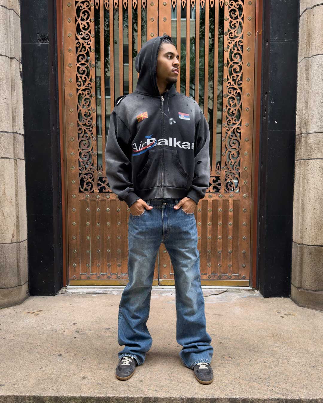 Bravest Studios Flare Denim Pants blue, full-length model shot styled with a black zip hoodie