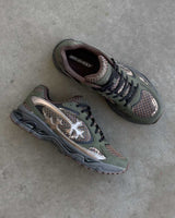 Bravest Studios Kross Kountry Runner Camo, pair on concrete showing the side profile and the BRAVEST branded insole