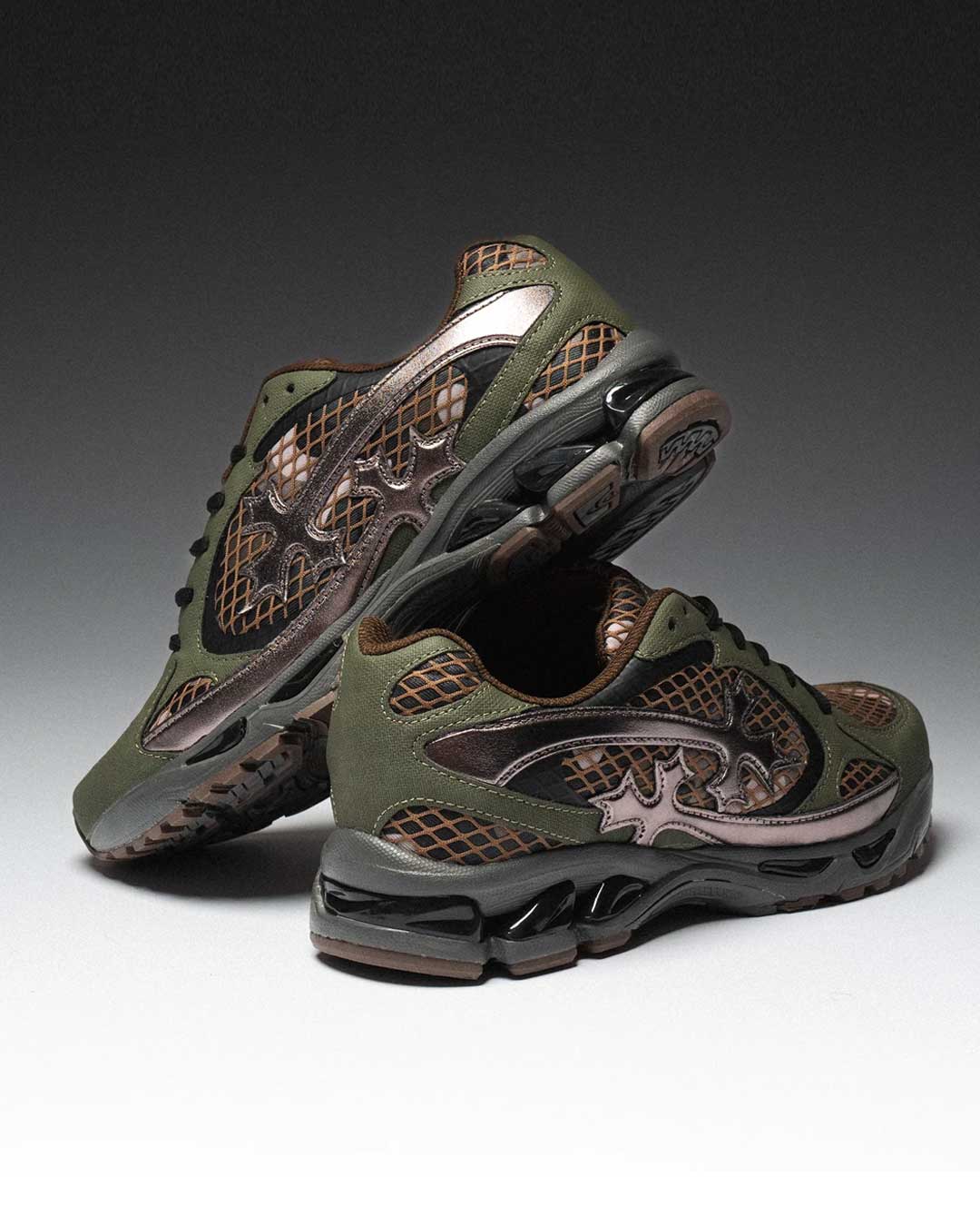 Bravest Studios Kross Kountry Runner Camo, olive and brown camo mesh runner with a bronze cross applique, pair stacked on a dark gradient backdrop