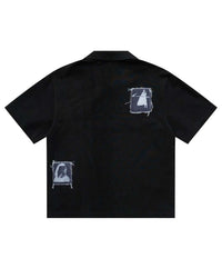 Bravest Studios Patch Polo black, back view showing two stitched-on photo patches