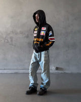 Bravest Studios Ransom Zip Up Hoodie black, worn by a model with the hood up, styled view