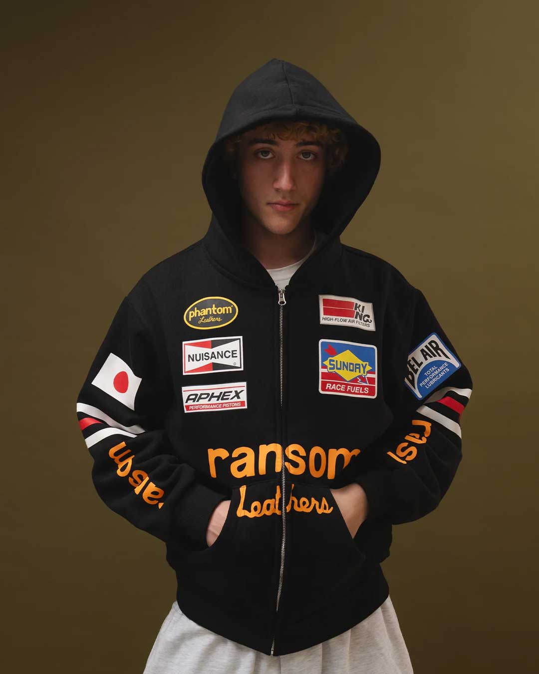 Bravest Studios Ransom Zip Up Hoodie black, worn by a model showing the full fit, styled view