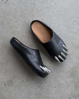 Bravest Studios Snake Claw Mule black snake-textured with chrome claw detailing, concrete view