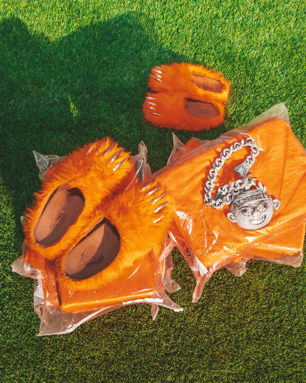 Bravest x Glogang Bear Claw Mule orange with chrome claw detailing, outside on grass
