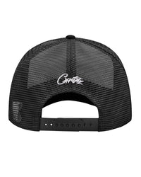 Corteiz Island Puff Print Trucker Hat white/black, back view showing black mesh panels, white Corteiz script embroidery and snapback closure