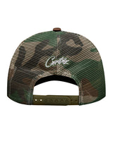 Corteiz Island Puff Print Trucker Hat woodland camo, back view showing camo mesh panels, white Corteiz script embroidery and snapback closure