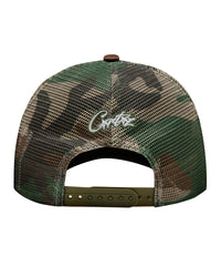Corteiz Island Puff Print Trucker Hat woodland camo, back view showing camo mesh panels, white Corteiz script embroidery and snapback closure