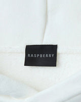 GV Gallery Blonde Hoodie white, close-up of the black woven Raspberry neck label