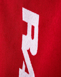GV Gallery RH Towel red, close-up of the white logo lettering on red terry