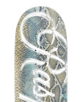 GV Gallery Snakeskin Skateboard, close-up of the snakeskin print and white script lettering