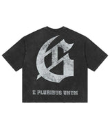 Godspeed Collegiate Tee Black Wash, back view showing the large distressed gothic G monogram above E PLURIBUS UNUM