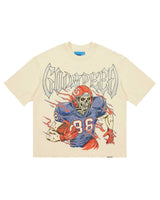 Godspeed Endzone Tee bone, cotton tee with a skeleton football player in a blue and red kit under outlined Gothic Godspeed lettering, front view
