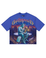 Godspeed Finally Tee Blue, royal blue tee with a seated Statue of Liberty holding a gold trophy, front view