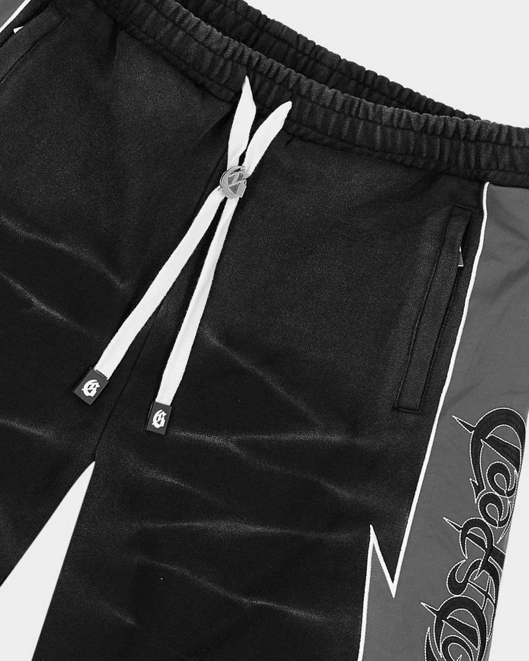 Godspeed Halftime Shorts V2 Black Acid Wash, side view showing the lightning-bolt panel seam and gothic script