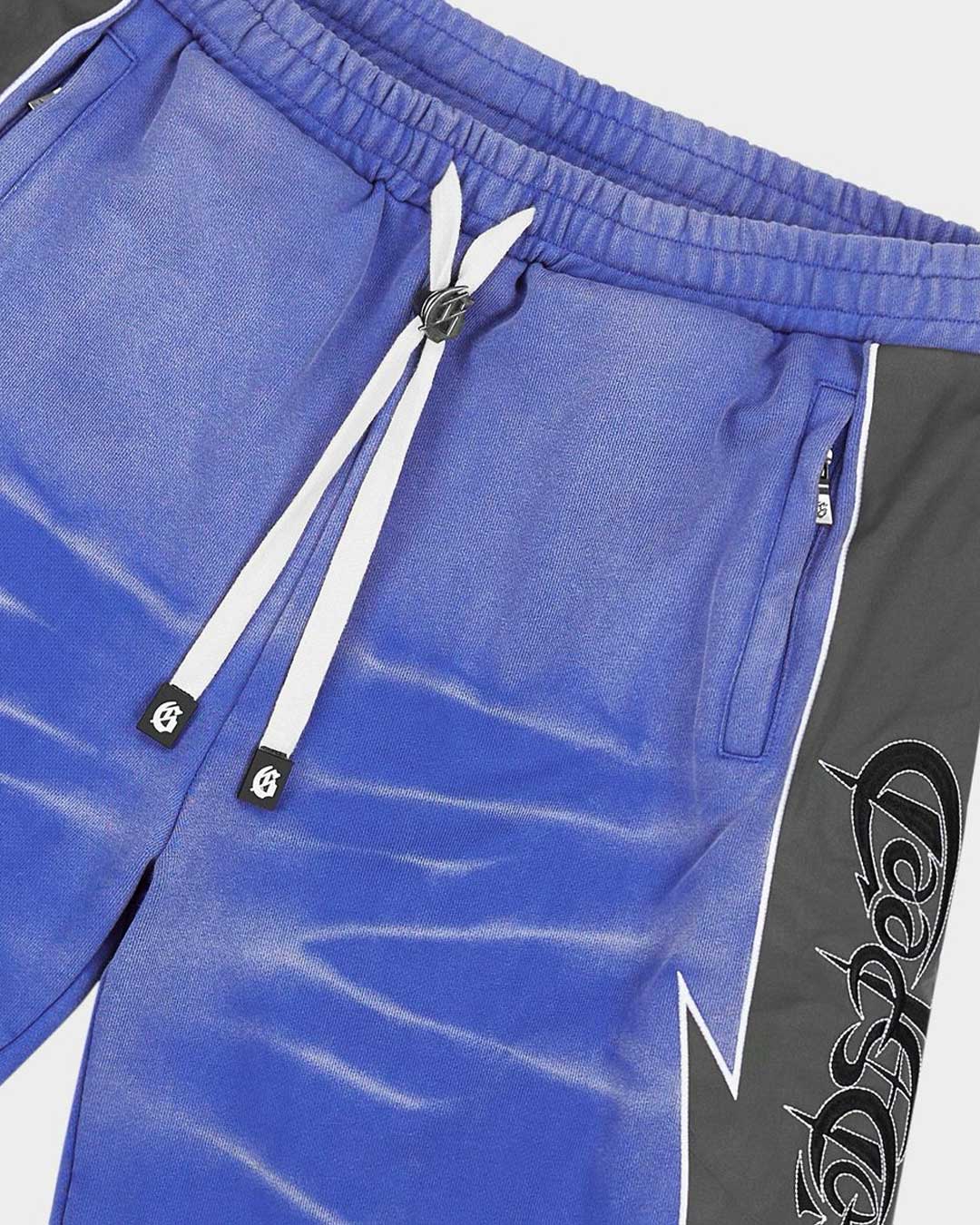 Godspeed Halftime Shorts V2 Blue Acid Wash, side view showing the lightning-bolt panel seam and gothic script