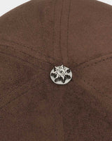 Godspeed Insignia Leather/Suede Hat chocolate brown and black, close-up of the metal sun emblem button at the crown
