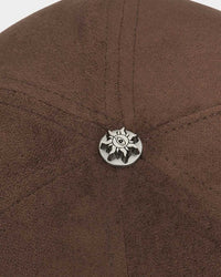 Godspeed Insignia Leather/Suede Hat chocolate brown and black, close-up of the metal sun emblem button at the crown