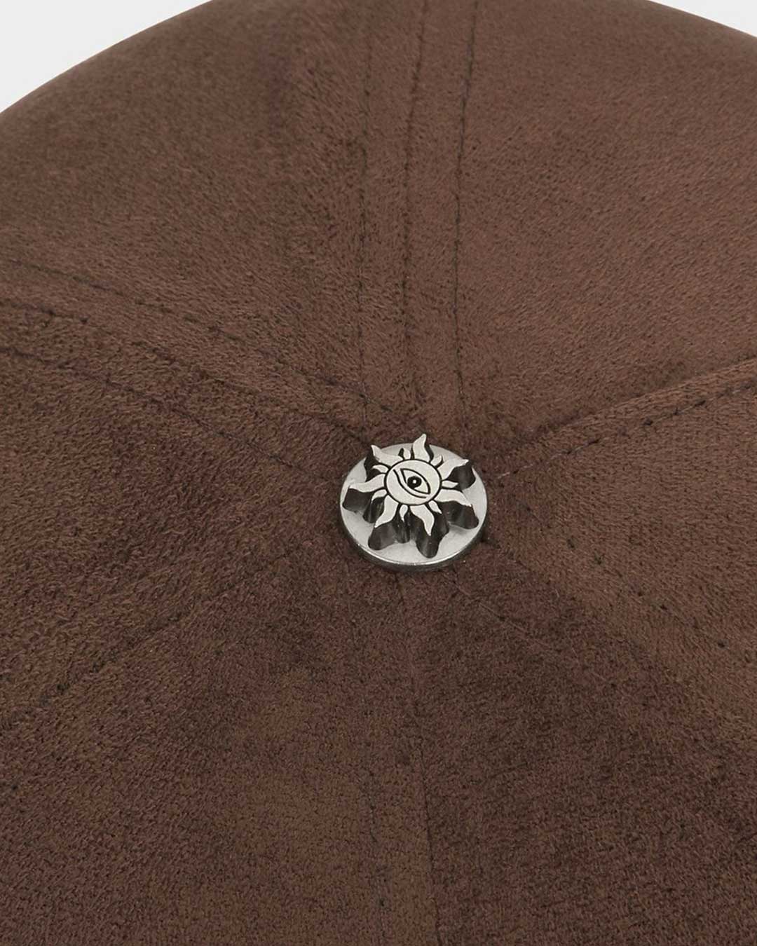 Godspeed Insignia Leather/Suede Hat chocolate brown and black, close-up of the metal sun emblem button at the crown