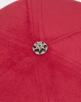 Godspeed Insignia Leather/Suede Hat red and black, close-up of the metal sun emblem button at the crown