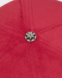 Godspeed Insignia Leather/Suede Hat red and black, close-up of the metal sun emblem button at the crown