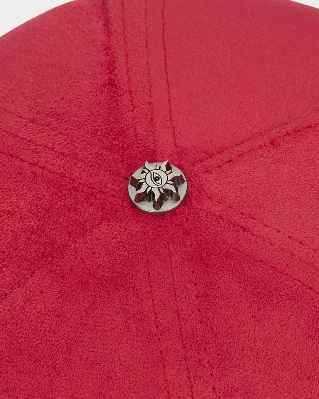 Godspeed Insignia Leather/Suede Hat red and black, close-up of the metal sun emblem button at the crown