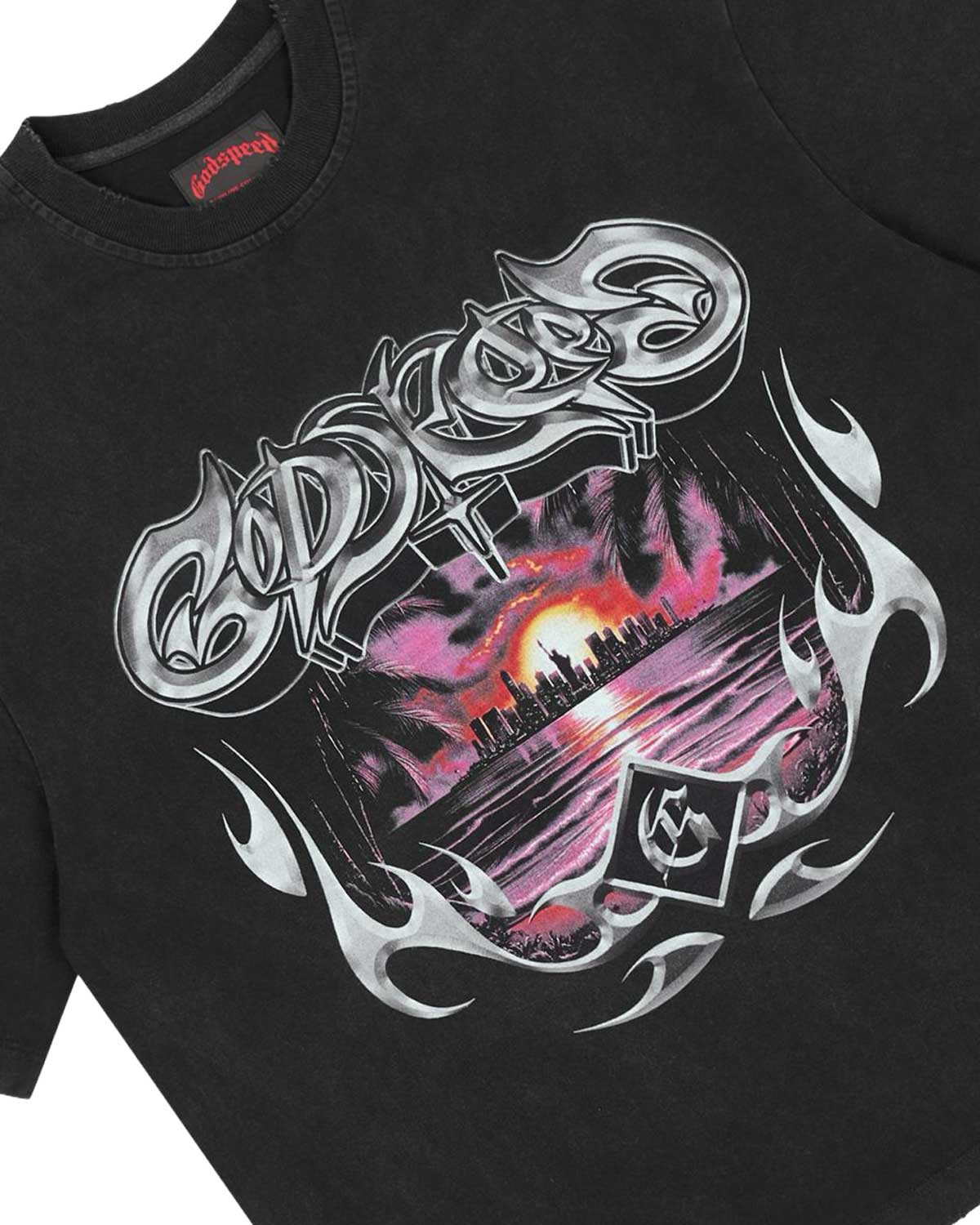 Godspeed Liberty Sunset Tee in black, close-up of the chrome tribal Godspeed graphic and sunset skyline