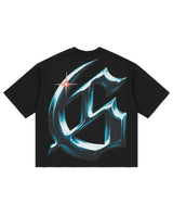 Godspeed New Age Reloaded Tee Black, back view showing the oversized chrome gothic G monogram with a red star flare