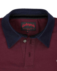 Godspeed Oversized Victor Crest Polo burgundy and navy, close-up of the navy contrast collar, button placket and woven Godspeed neck label
