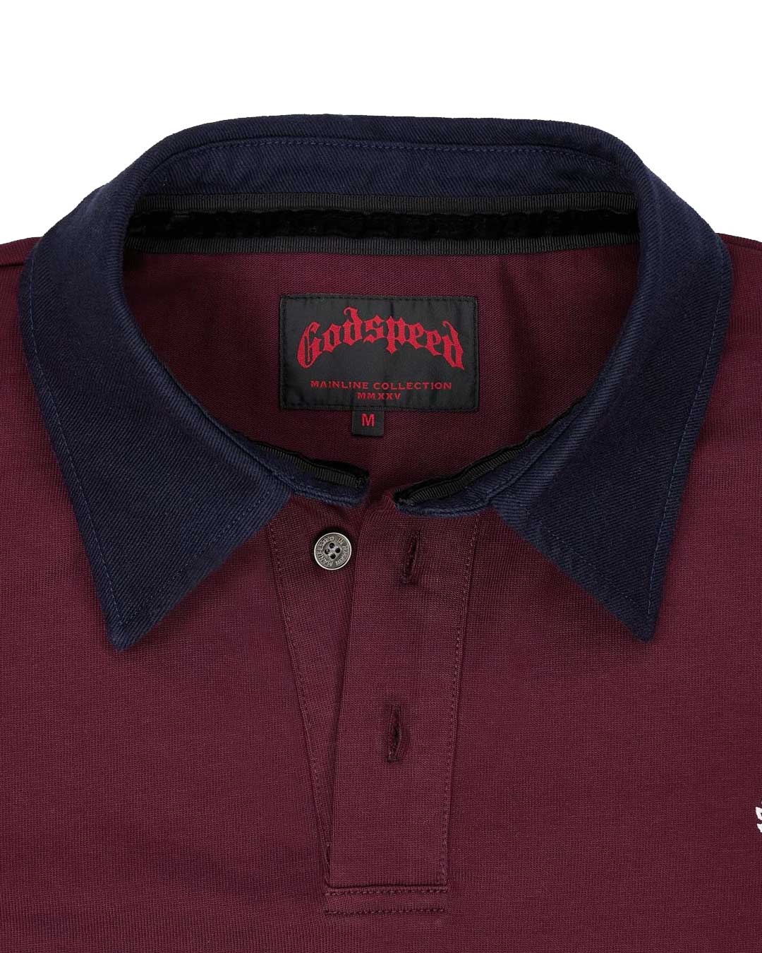 Godspeed Oversized Victor Crest Polo burgundy and navy, close-up of the navy contrast collar, button placket and woven Godspeed neck label