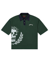Godspeed Oversized Victor Crest Polo green and navy, piqué polo with a navy collar and white skull-and-laurel crest, front view