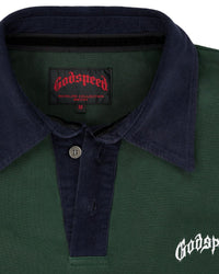 Godspeed Oversized Victor Crest Polo green and navy, close-up of the navy contrast collar, button placket and woven Godspeed neck label