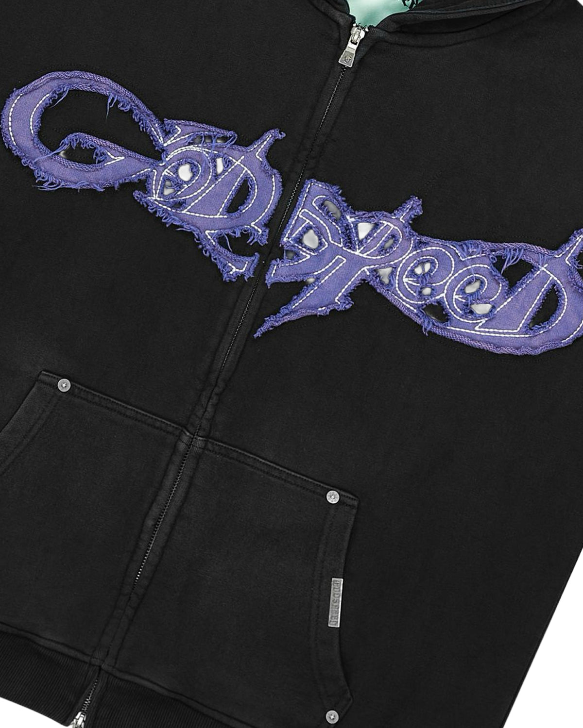 Godspeed Raw Import Sweatsuit black/blue, close-up of the blue-violet graffiti lettering on the hoodie chest
