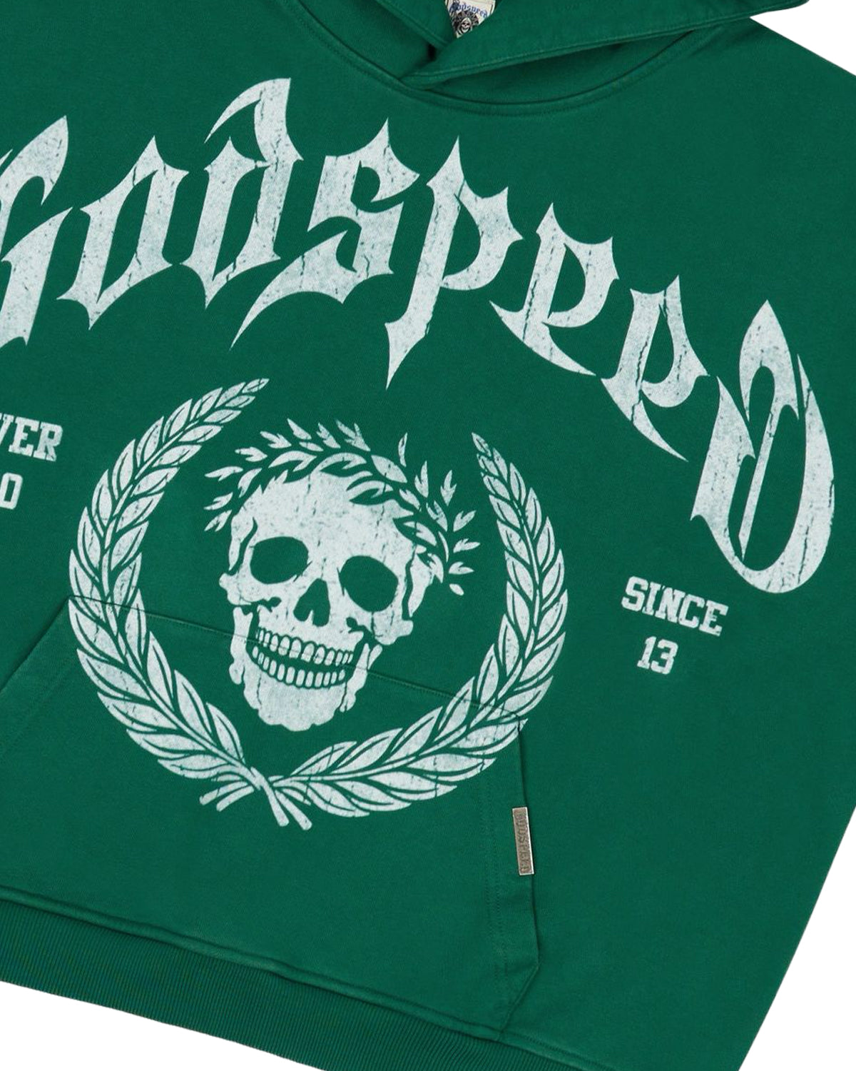 Godspeed Victor Crest Sweatsuit green, close-up of the skull crest and Godspeed lettering on the hoodie chest