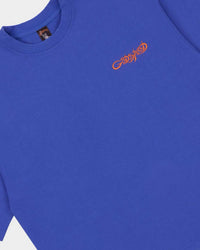 Godspeed Vital Necessi Tee NYK blue, close-up of the orange Godspeed chest script