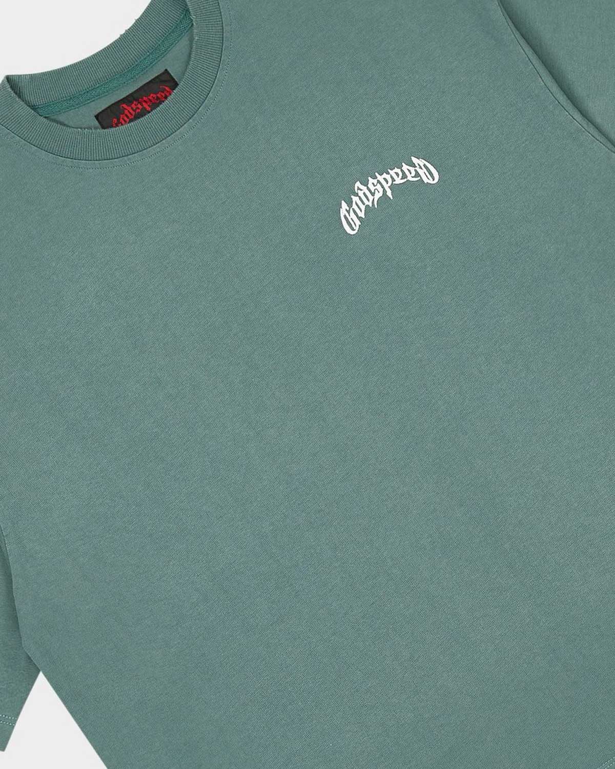 Godspeed Vital Necessi Tee sage smoke, close-up of the arched blackletter Godspeed chest wordmark