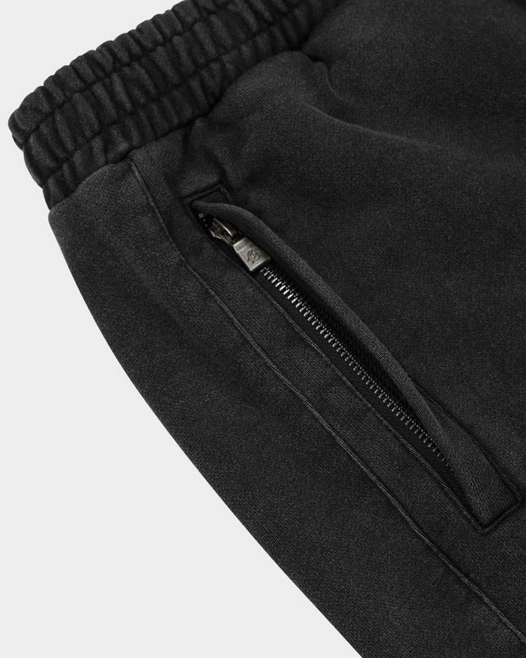 Godspeed Vital Short Set black wash with pink logo, close-up of the zip side pocket