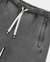 Godspeed Vital Short Set grey wash, close-up of the script on the shorts leg