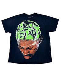 Hellstar Rodman Tee black, cotton tee with an oversized portrait graphic and HELLSTAR shaved into bleached green hair, front view