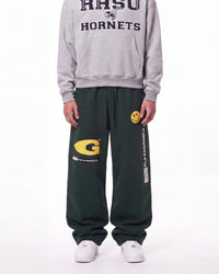 A person wearing dark green sweatpants with a yellow 'G' logo and white sneakers, paired with a gray hoodie featuring 'RHSU HORNETS' text, shown against a plain white background.