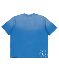 Pieces Brotherhood Tee faded blue, back view with paint-splatter distressing at the hem
