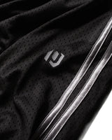 Pieces Hoop Long Shorts black, close-up of the PCS logo and white side stripes on the mesh