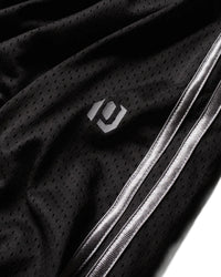 Pieces Hoop Long Shorts black, close-up of the PCS logo and white side stripes on the mesh