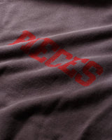 Pieces SM Surf Sweatshirt washed navy, close-up of red distressed lettering on the faded fabric