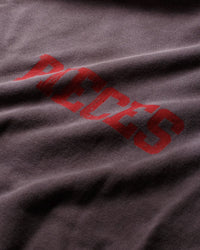 Pieces SM Surf Sweatshirt washed navy, close-up of red distressed lettering on the faded fabric