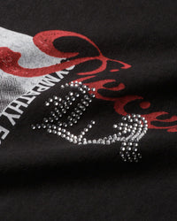 Pieces Sympathy Tee vintage black, close-up of red script and rhinestone lettering