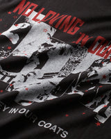 Pieces Sympathy Tee vintage black, close-up of the distressed collage and red lettering