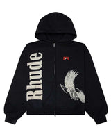 Rhude Eagle Pass Zip Up Hoodie black, zip hoodie with vertical cream Rhude lettering and an eagle graphic, front view