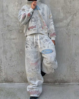 Model wearing Righteous Jesus My Lord grey sweatpants with matching hoodie against a concrete wall